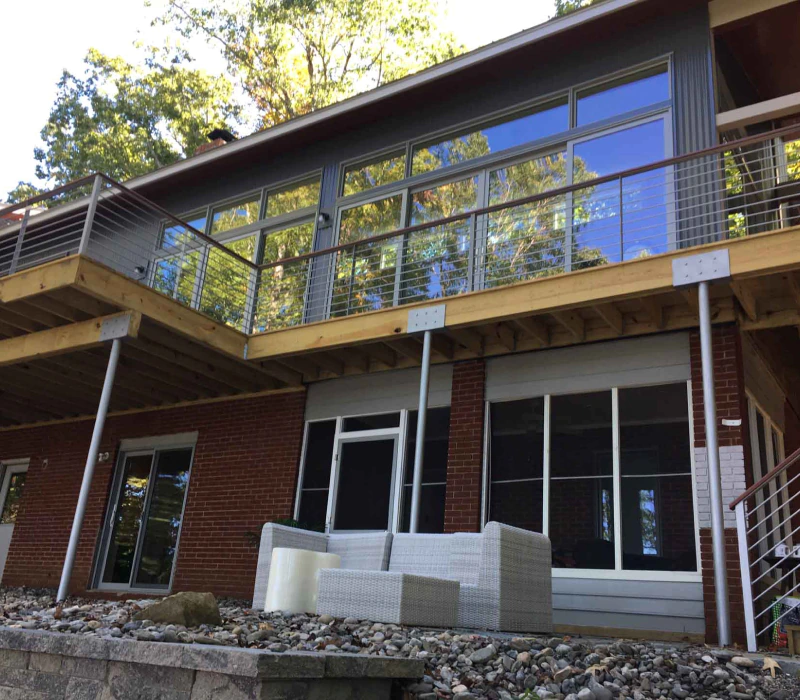 new metal roofing and elevated deck with metal railings