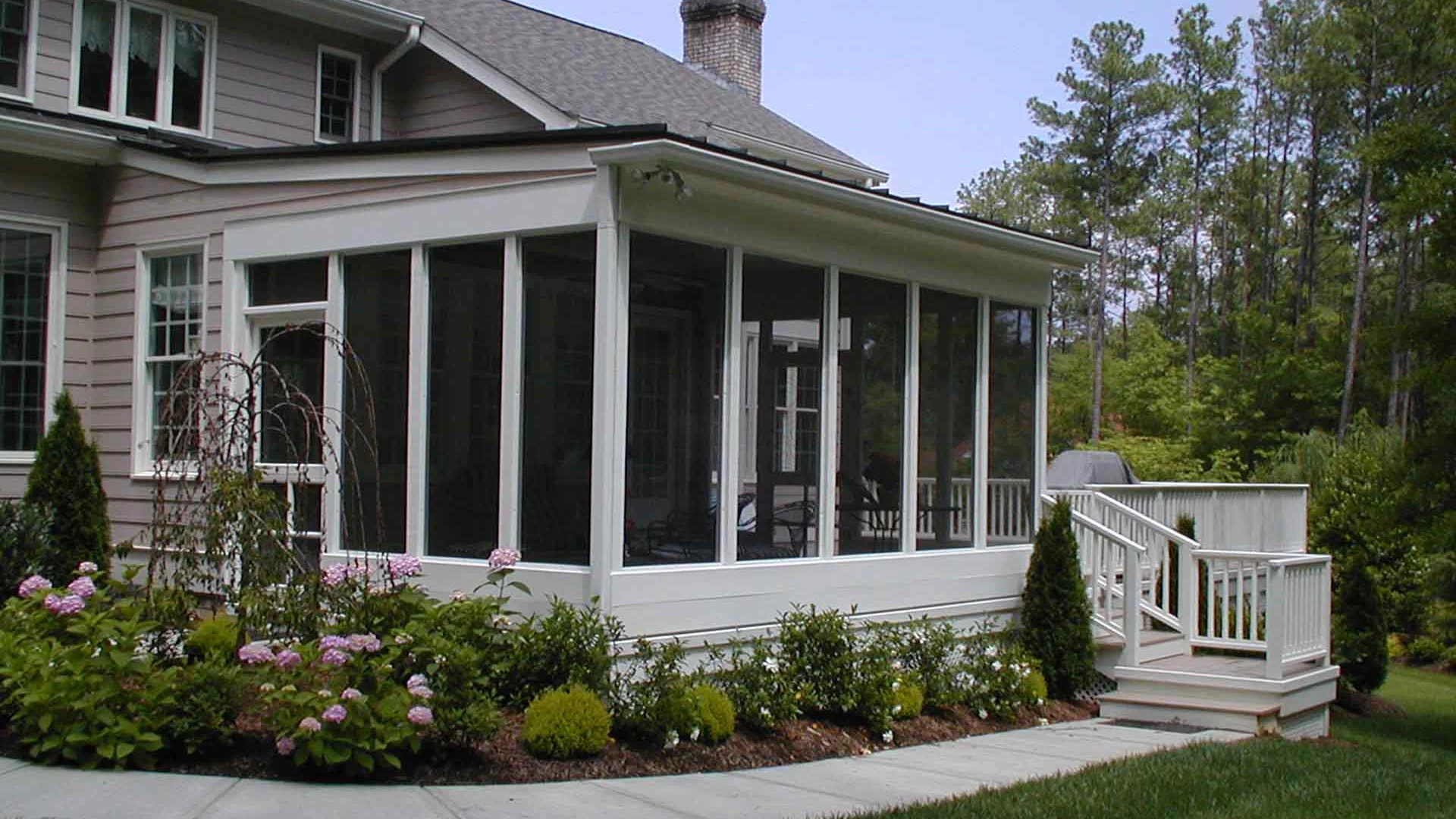 residential house with closed patio and beautiful landscape